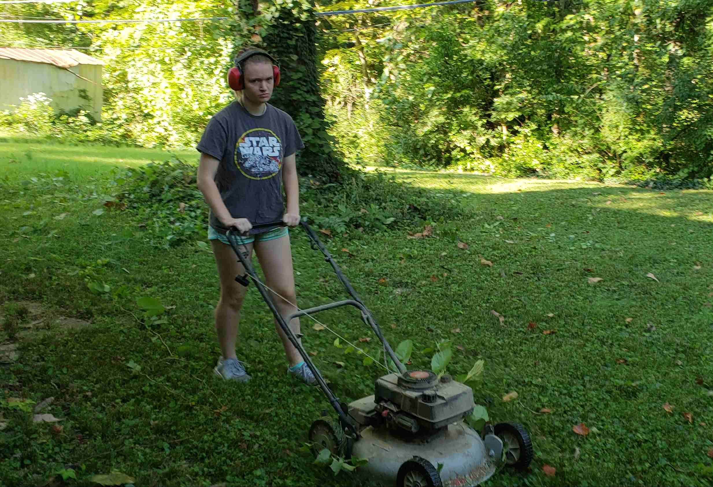 2018-09-15 Cate Mowing the lawn.jpg